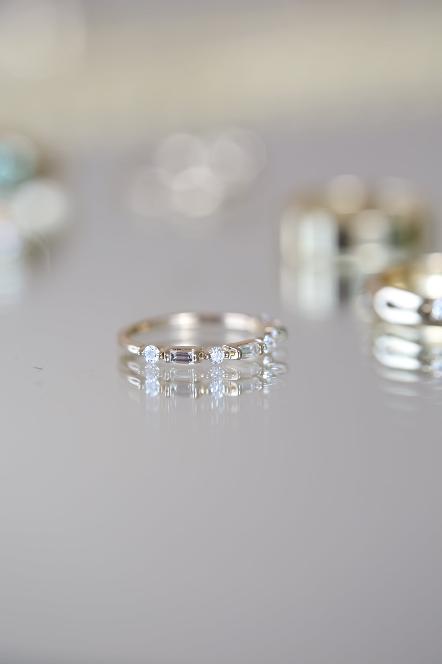 Editorial photo of Joelle Ring styled on reflective glass.